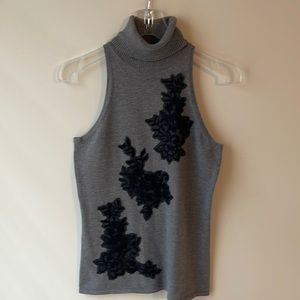 White House Black Market sleeveless turtleneck with lace appliqué.  Size small.